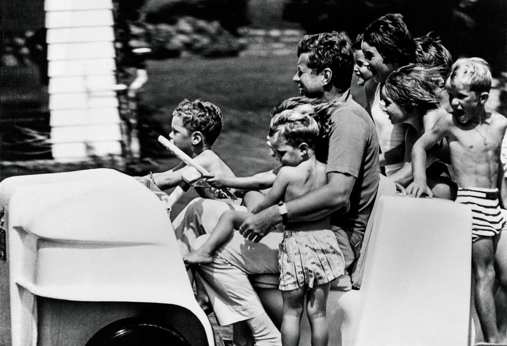 John F. Kennedy playing with children
